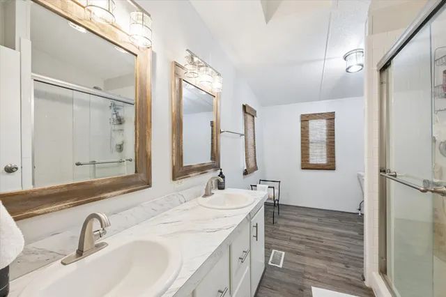 a bathroom with a sink and a mirror