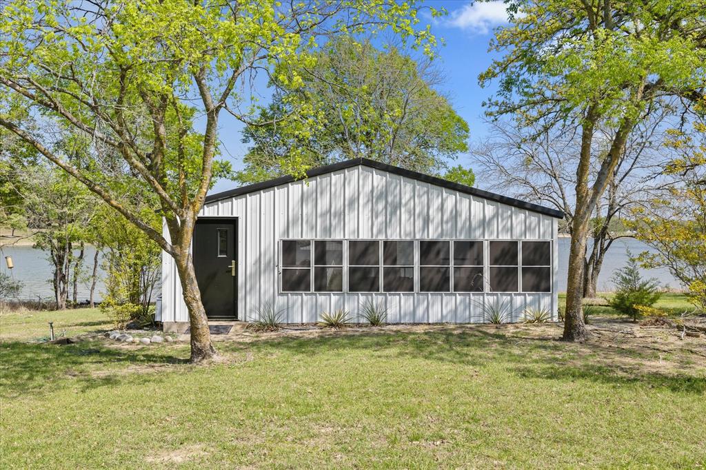 2776 Waters Edge Quinlan, TX 75474 - Photo 13 of 28 a view of a house with a yard