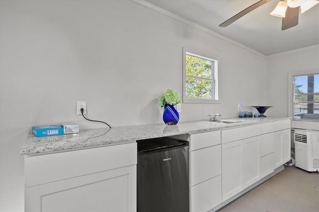 2776 Waters Edge Quinlan, TX 75474 - Photo 15 of 28 a bathroom with a sink and a mirror