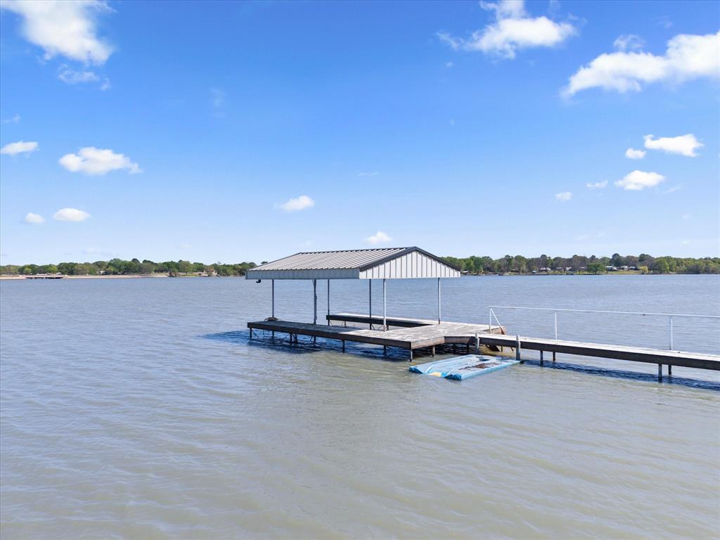 2776 Waters Edge Quinlan, TX 75474 - Photo 7 of 28 a view of a lake with sitting area