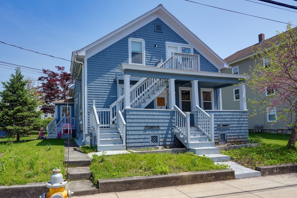 5 Eddy Street, Unit 2 Webster, MA 01570 - Photo 3 of 18 a front view of a house with a garden