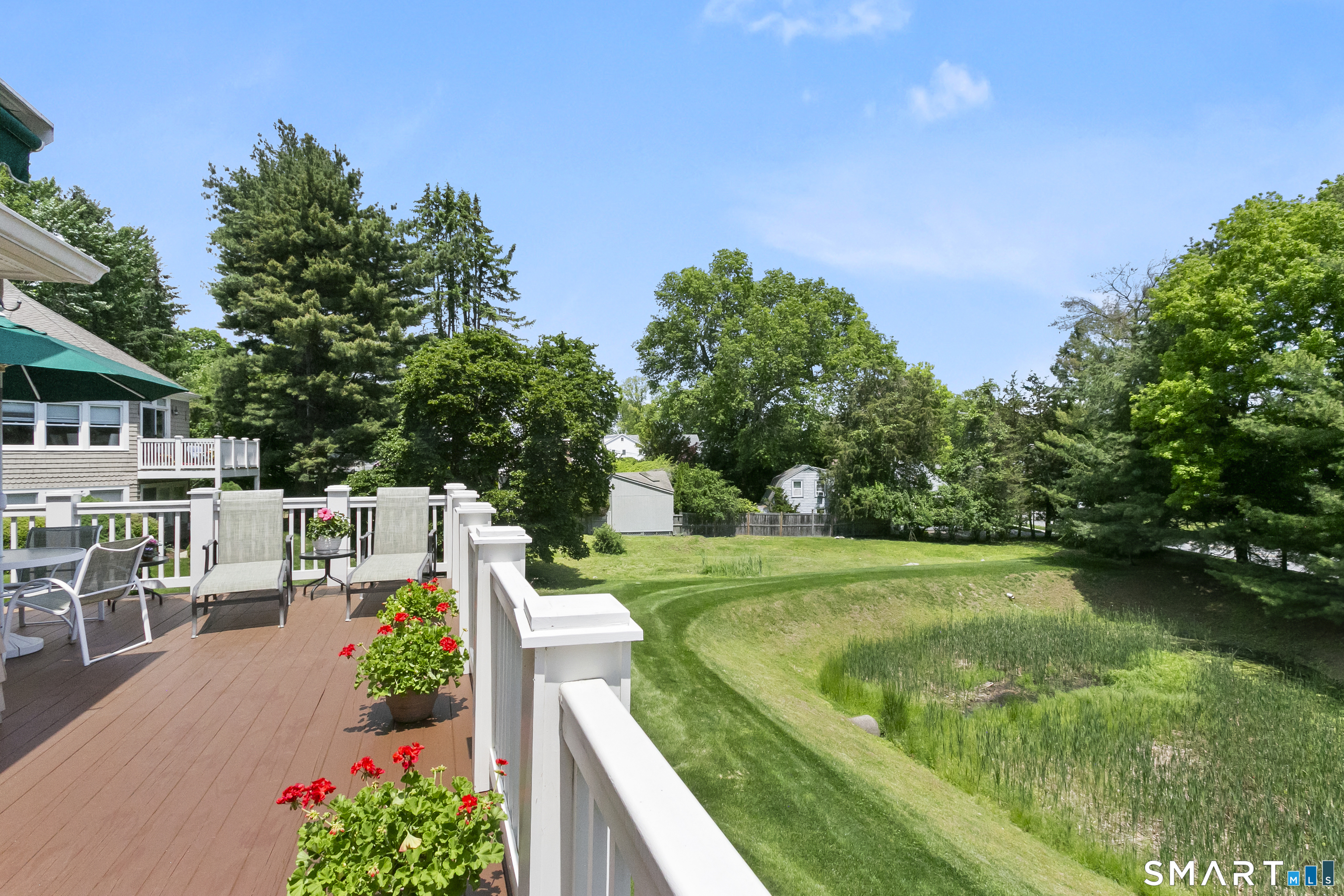 936 South Pine Creek Road Fairfield, CT 06824 - Photo 29 of 39 This gorgeous, sun drenched back deck overlooks open space surrounded by nature.