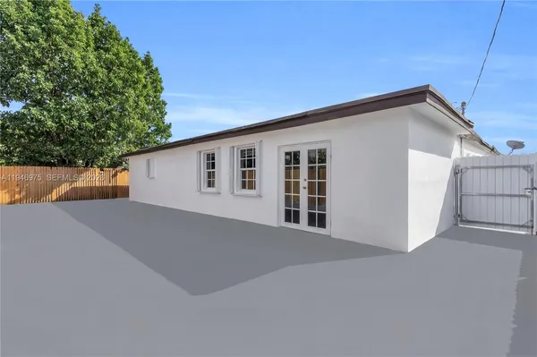 aerial view of a house with a yard