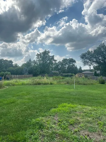 a view of a golf course with a lake