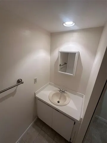 a bathroom with a sink and mirror