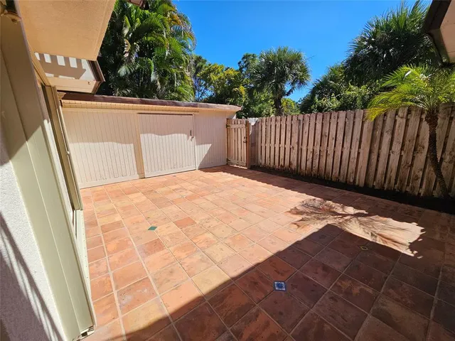 a view of balcony with wooden floor