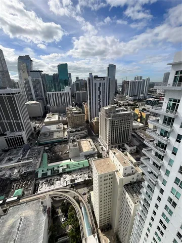 a view of living room with furniture and lamp