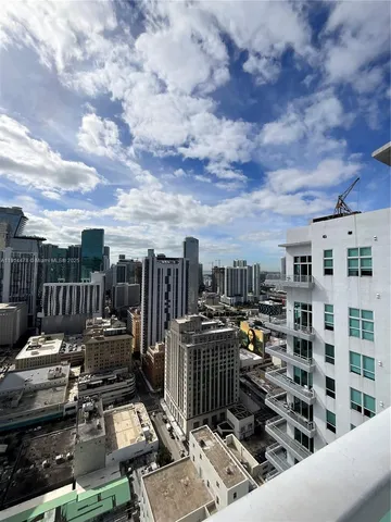 a room with pool table and a lamp