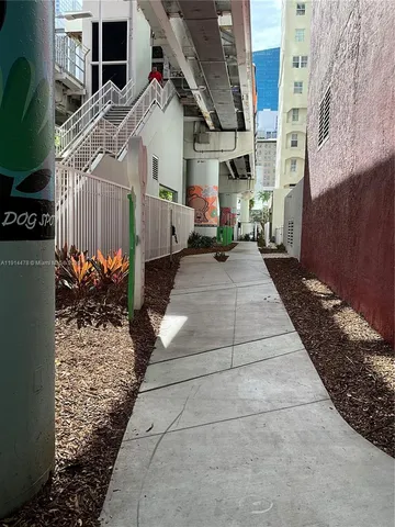 a view of a pathway with a house