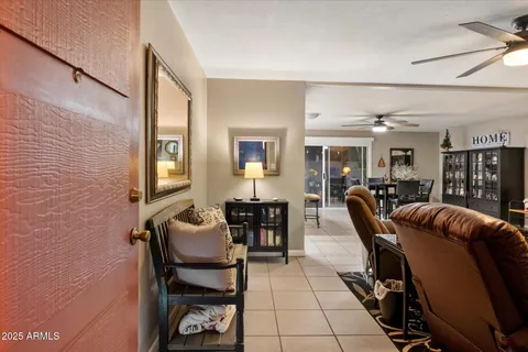 a living room with furniture rug and wooden floor