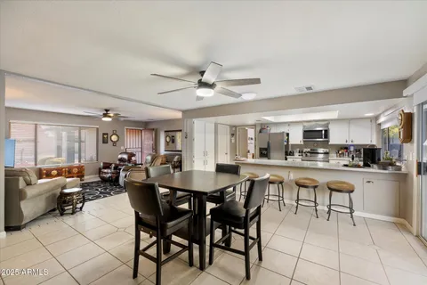 a view of a dining room with furniture window and outside view