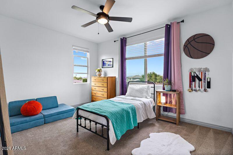 7871 South Stuart Avenue Gilbert, AZ 85298 - Photo 27 of 77 a bedroom with a bed dresser and window