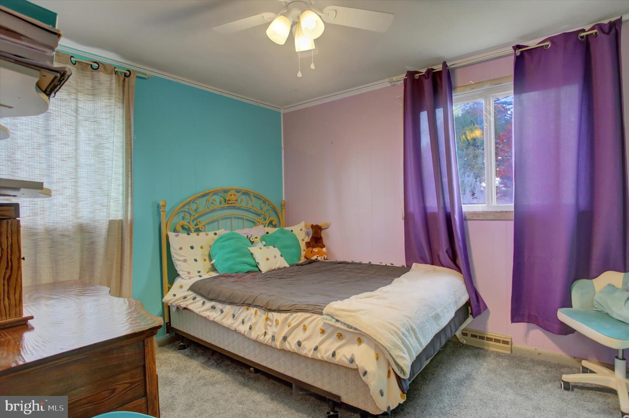 2688 Rocky Spring Road Chambersburg, PA 17201 - Photo 19 of 36 a bedroom with a bed dresser and a window