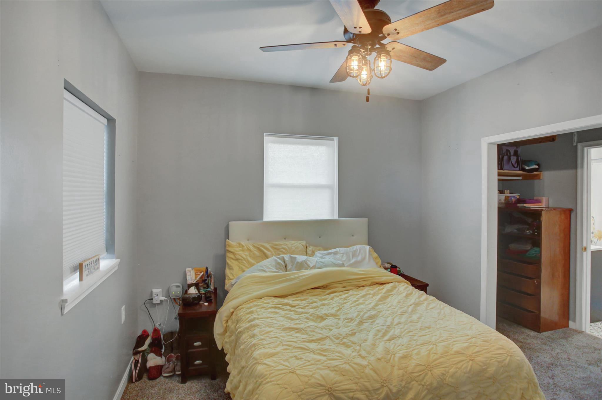 2688 Rocky Spring Road Chambersburg, PA 17201 - Photo 21 of 36 a bedroom with a bed and a chandelier