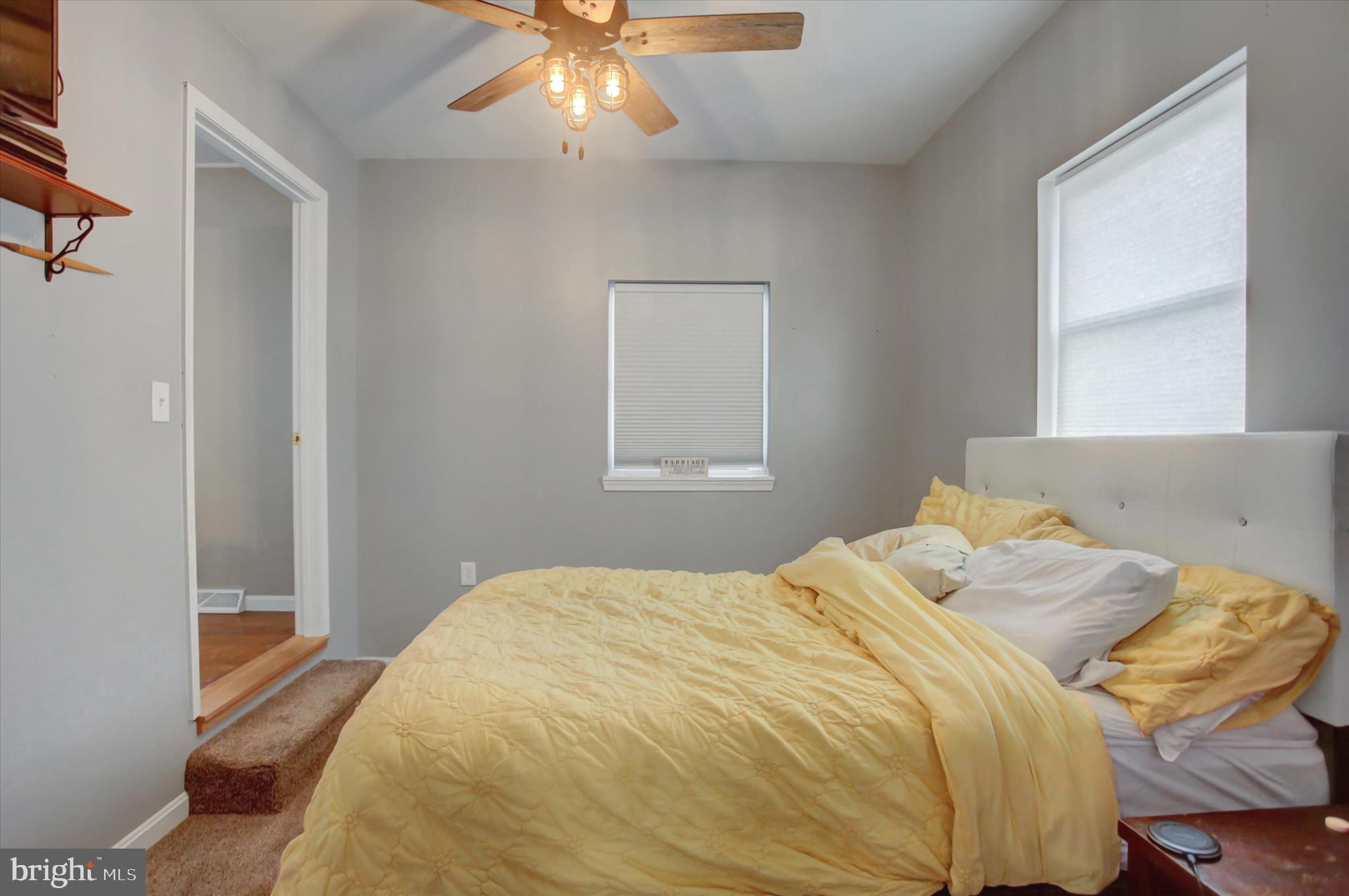 2688 Rocky Spring Road Chambersburg, PA 17201 - Photo 22 of 36 a bedroom with a bed and a chandelier