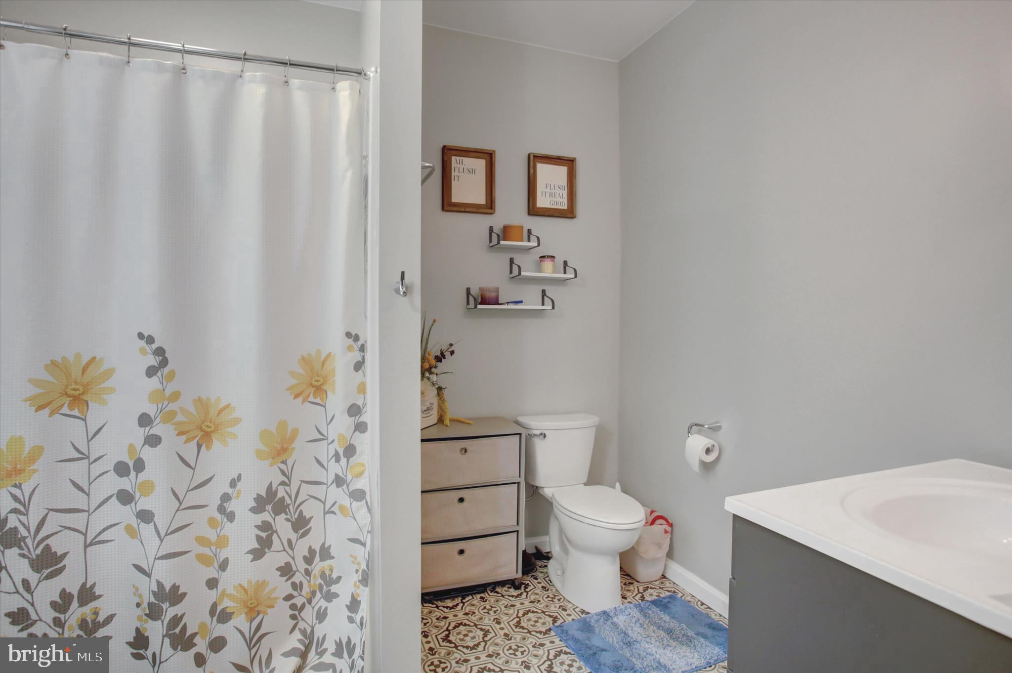 2688 Rocky Spring Road Chambersburg, PA 17201 - Photo 24 of 36 a bathroom with a toilet a sink and curtain