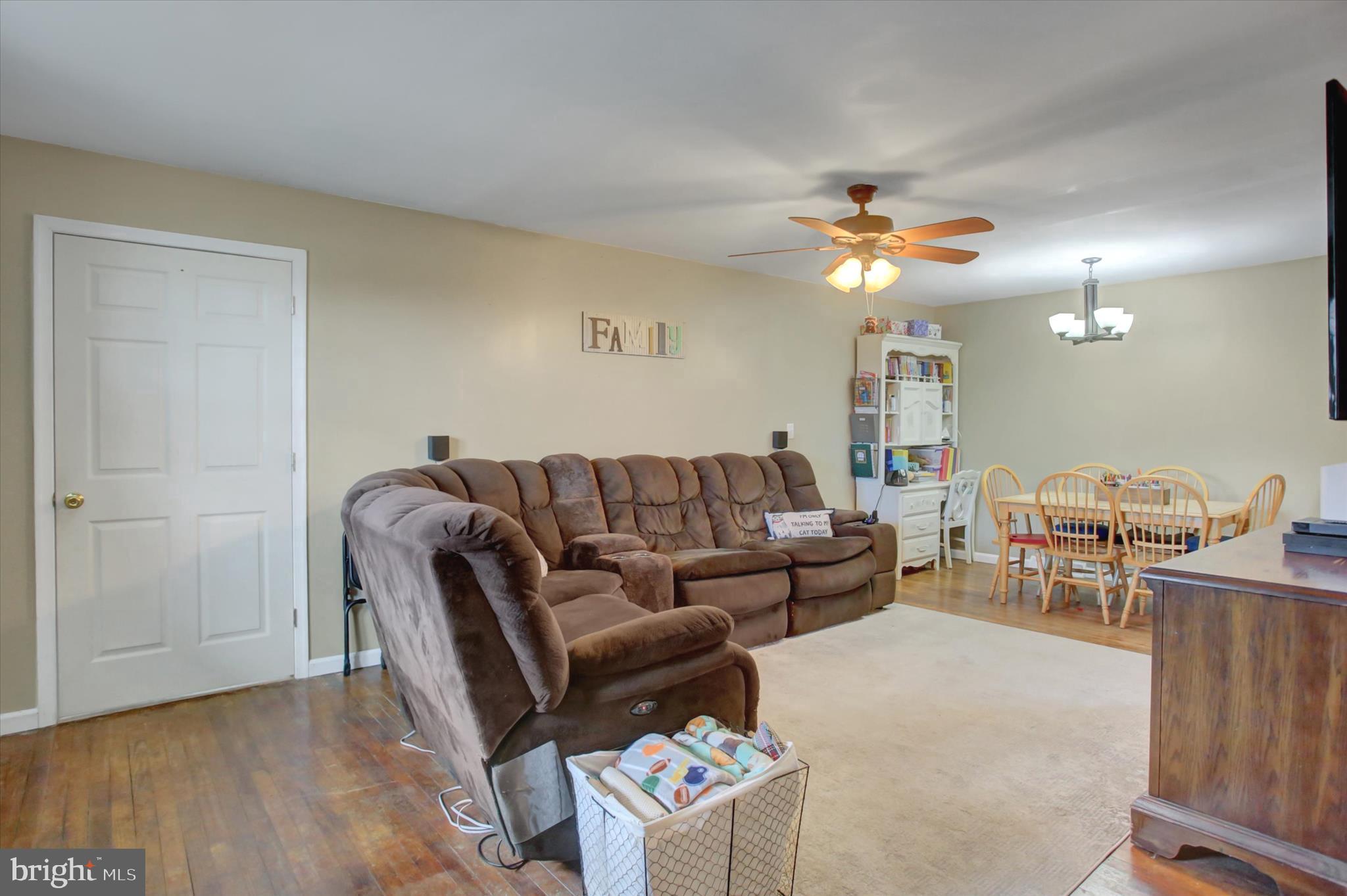2688 Rocky Spring Road Chambersburg, PA 17201 - Photo 6 of 36 a living room with furniture a ceiling fan and a rug