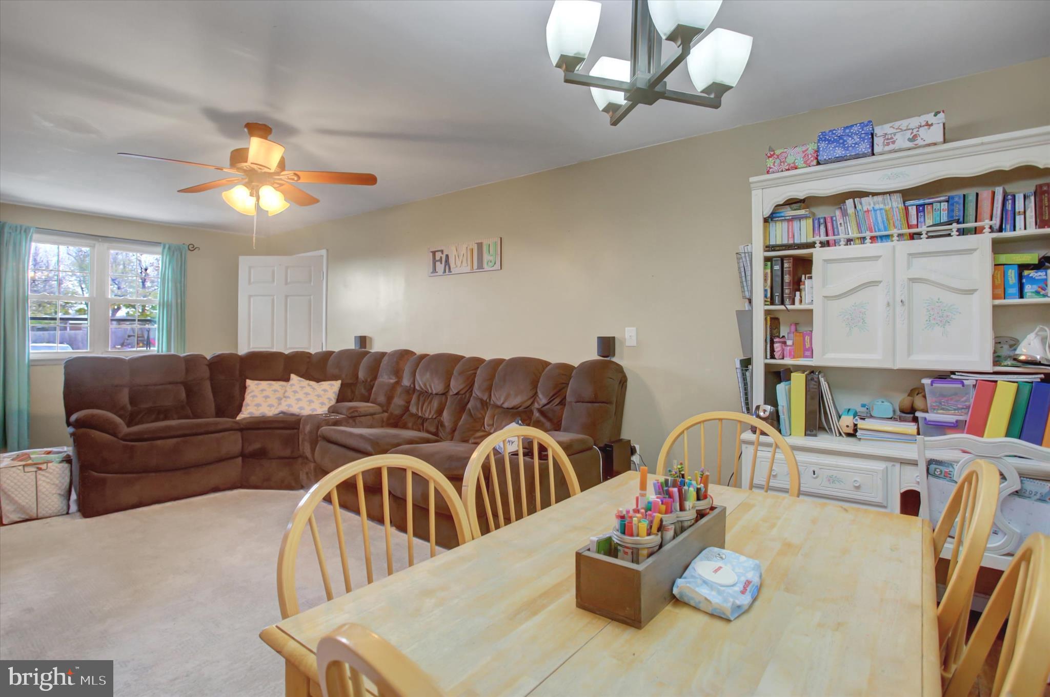 2688 Rocky Spring Road Chambersburg, PA 17201 - Photo 9 of 36 a living room with furniture and a bookshelf