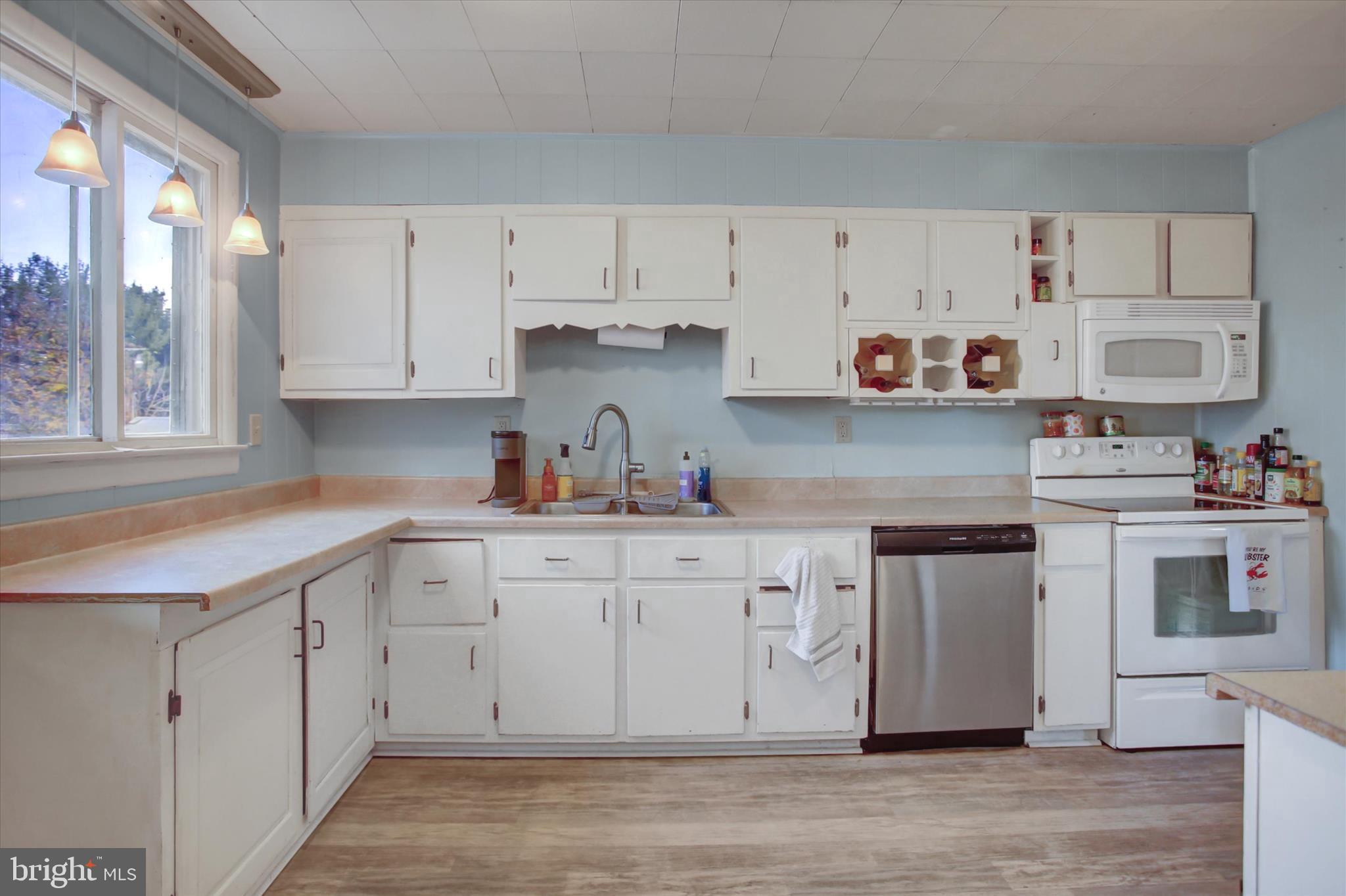 2688 Rocky Spring Road Chambersburg, PA 17201 - Photo 10 of 36 a kitchen with cabinets appliances and a sink