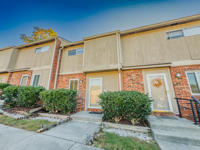 a view of a building with potted plants