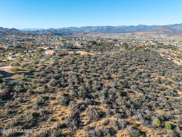 an aerial view of residential building and trees around