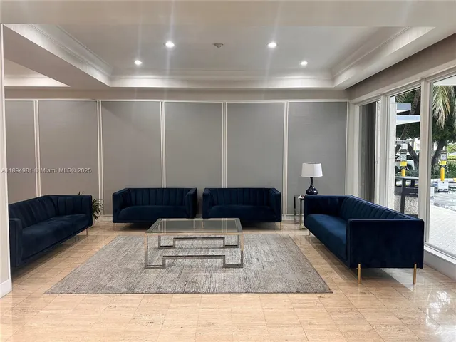 a kitchen with granite countertop a sink stove and refrigerator