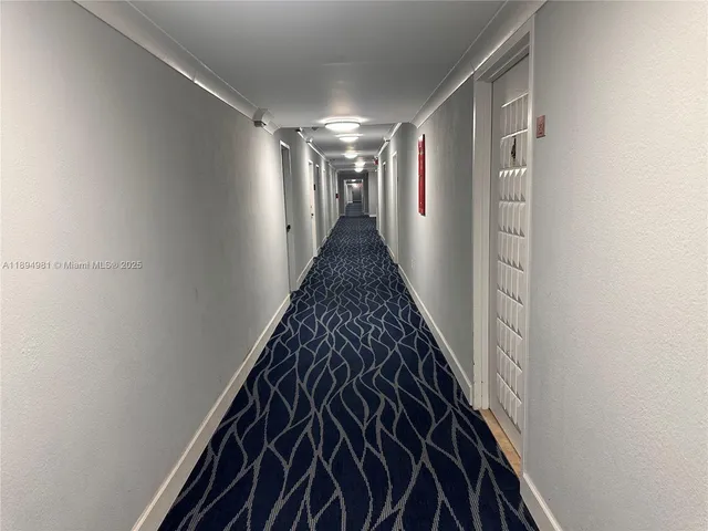 a view of a dining room with furniture wooden floor and chandelier