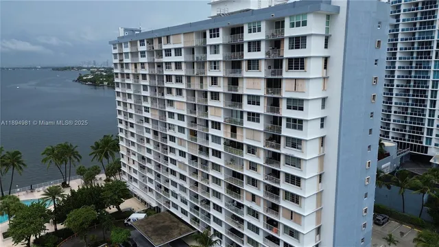 a view of a building with a black and white checkered floor