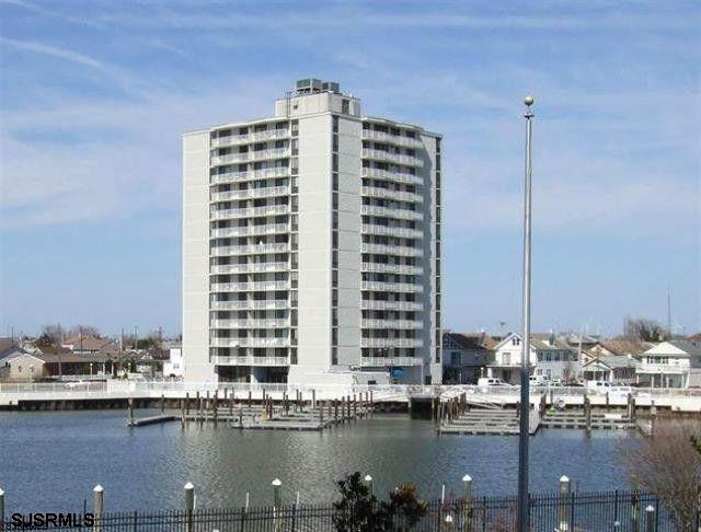 a view of ocean with large building
