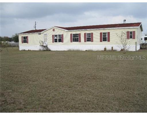 10519 Albritton Road Lithia, FL 33547 - Photo 1 of 1 a front view of a house with garden