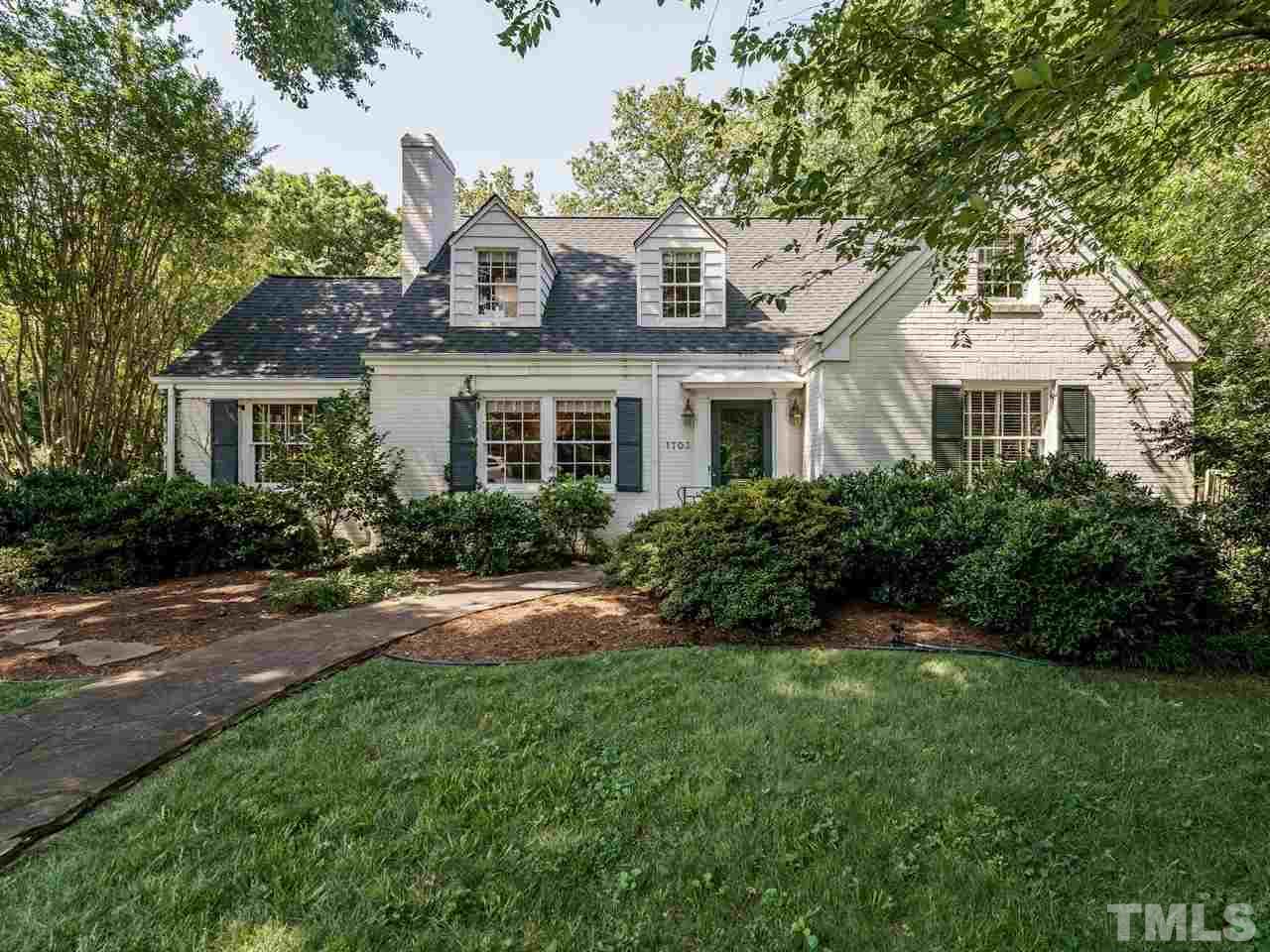 1703 Fairview Road Raleigh, NC 27608 - Photo 2 of 30 a front view of a house with a yard and trees