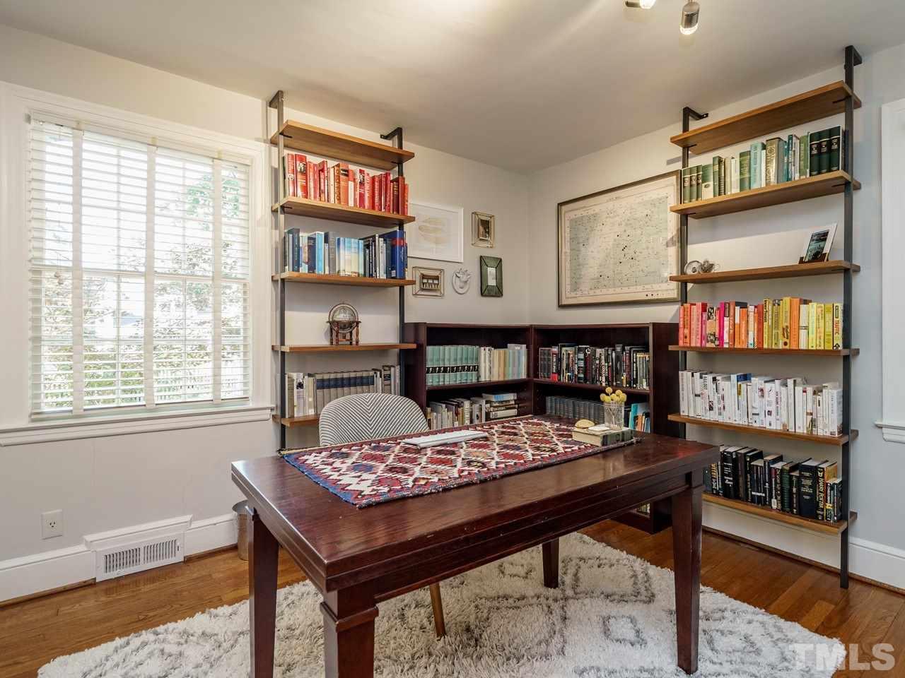 1703 Fairview Road Raleigh, NC 27608 - Photo 15 of 30 a area with furniture and a book shelf