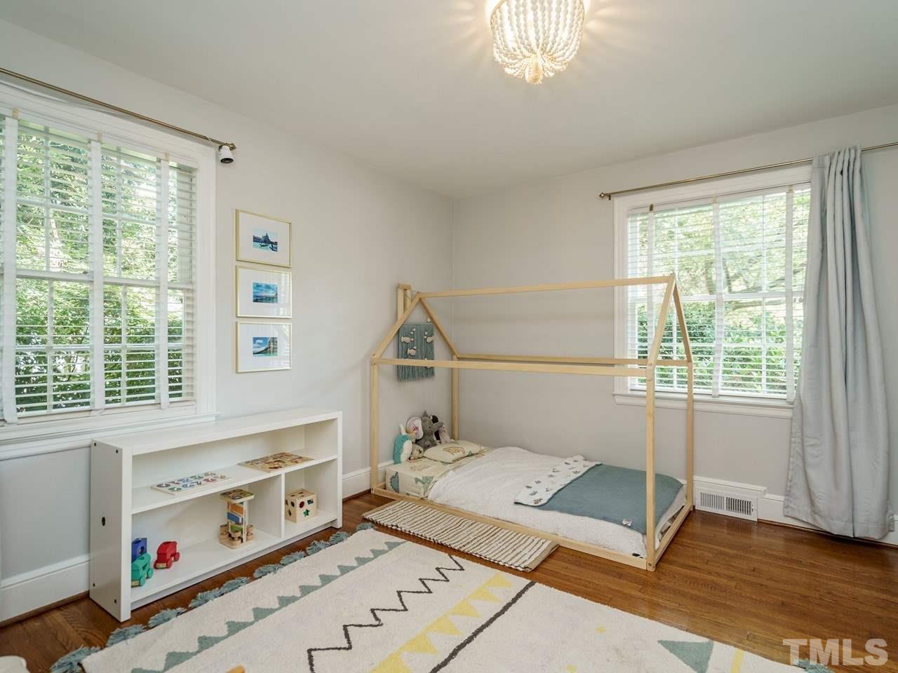 1703 Fairview Road Raleigh, NC 27608 - Photo 17 of 30 a living room with furniture and a window