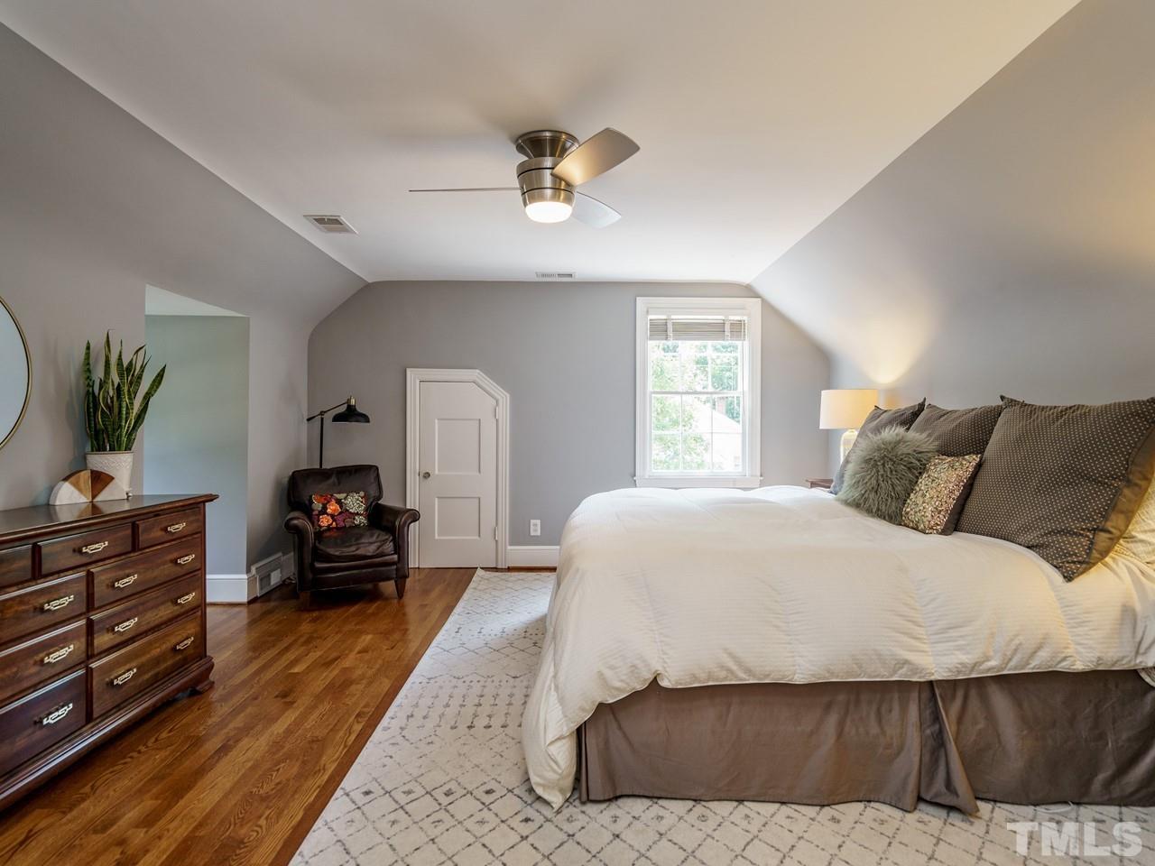 1703 Fairview Road Raleigh, NC 27608 - Photo 18 of 30 a spacious bedroom with a bed and window