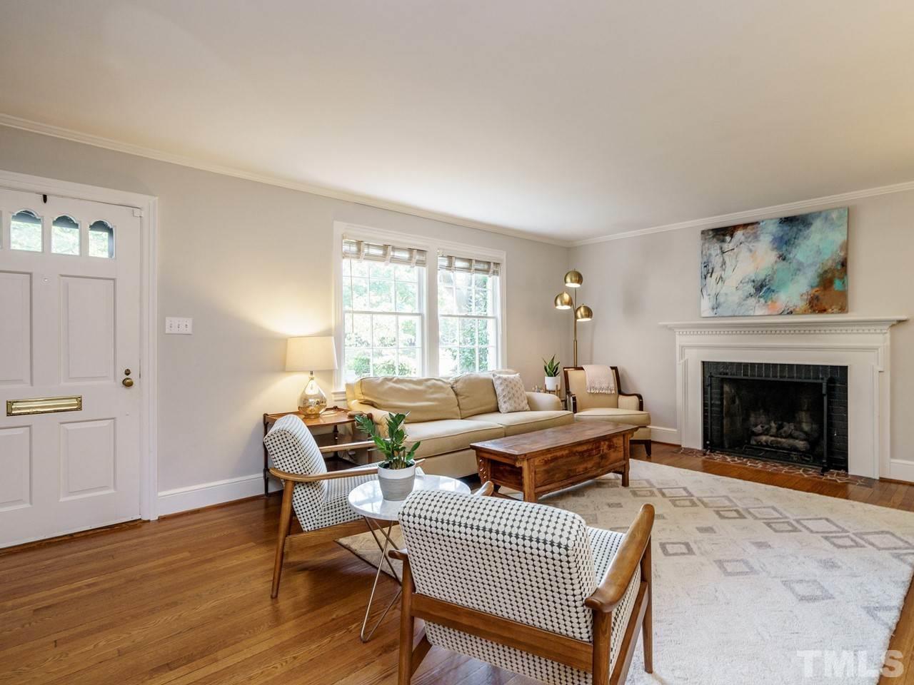 1703 Fairview Road Raleigh, NC 27608 - Photo 3 of 30 a living room with furniture and a fireplace