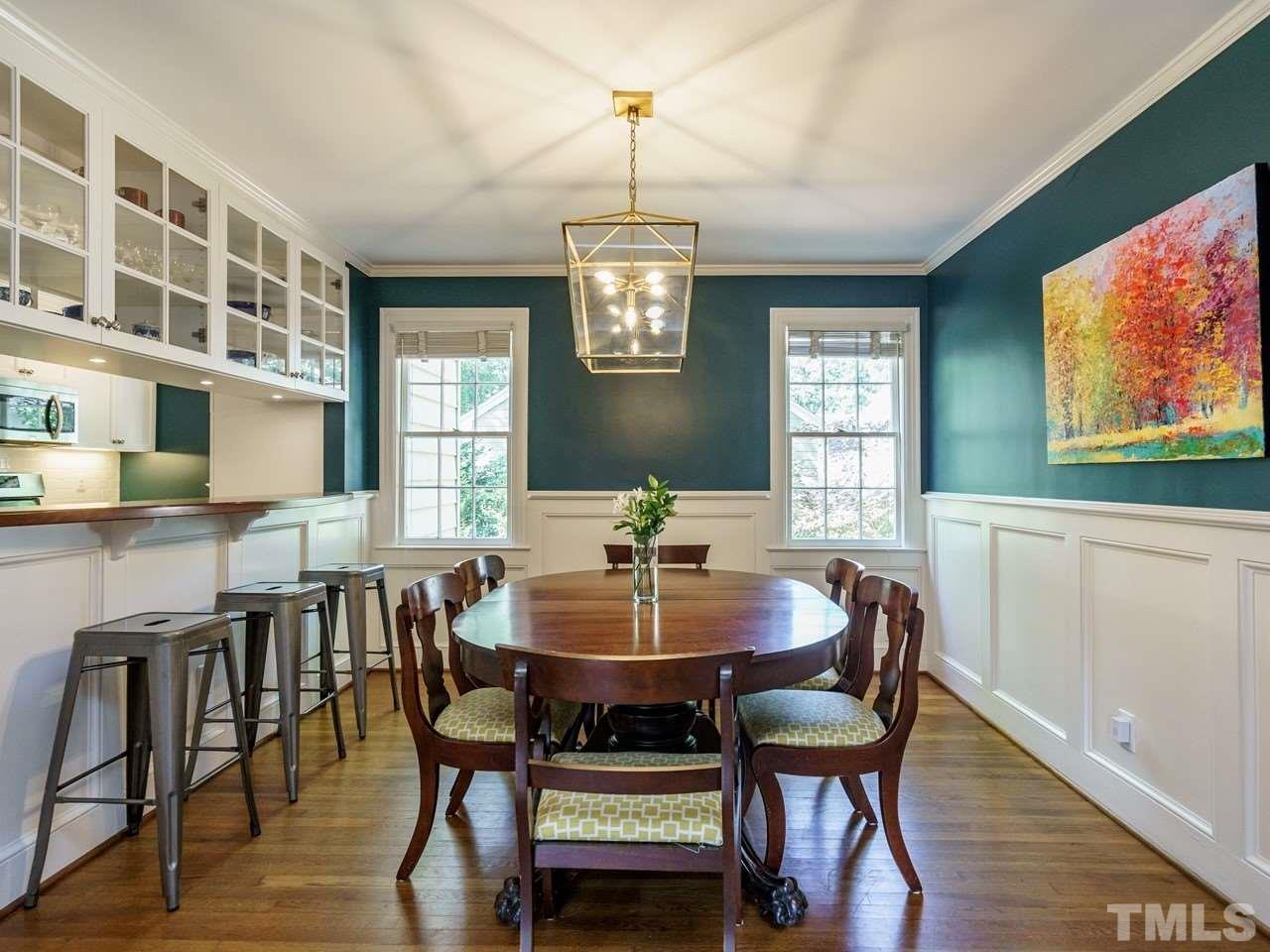 1703 Fairview Road Raleigh, NC 27608 - Photo 7 of 30 a view of a dining room with furniture window and wooden floor