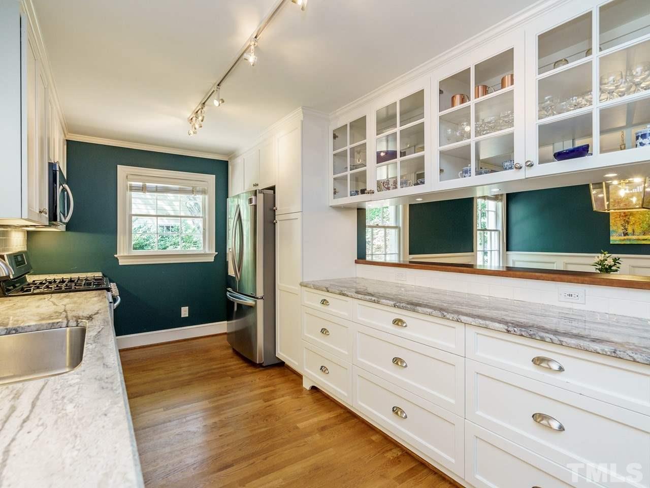 1703 Fairview Road Raleigh, NC 27608 - Photo 10 of 30 a view of granite countertop cabinets and a wooden floor