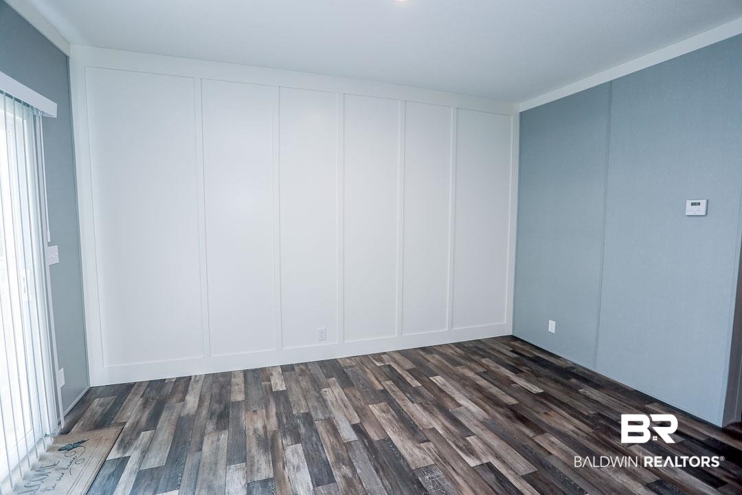 19180 Horseshoe Circle Seminole, AL 36574 - Photo 16 of 38 Unfurnished room featuring dark wood-type flooring