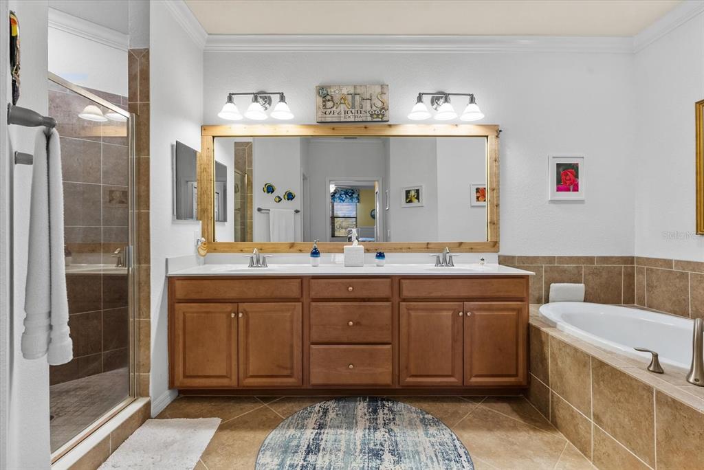 20080 Ragazza Circle, Unit 202 Venice, FL 34293 - Photo 21 of 51 a spacious bathroom with a granite countertop sink and a mirror
