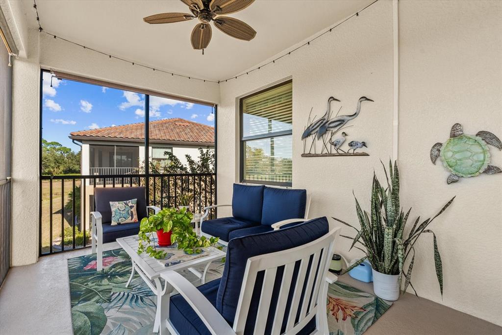 20080 Ragazza Circle, Unit 202 Venice, FL 34293 - Photo 27 of 51 a view of a dining room with furniture window and outside view