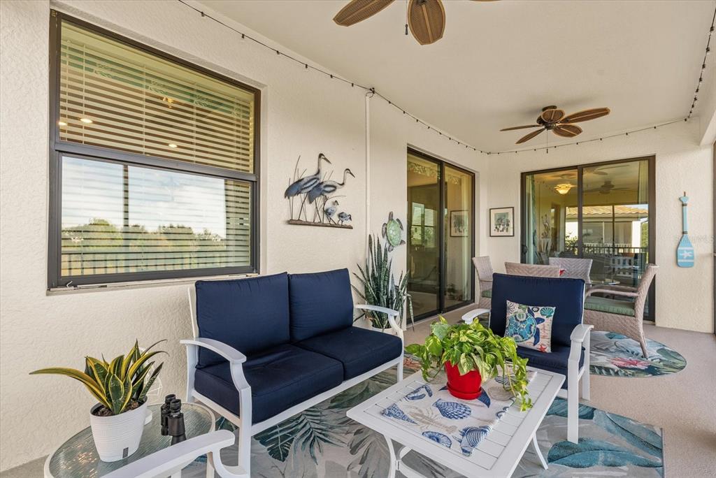 20080 Ragazza Circle, Unit 202 Venice, FL 34293 - Photo 28 of 51 a living room with furniture and a potted plant