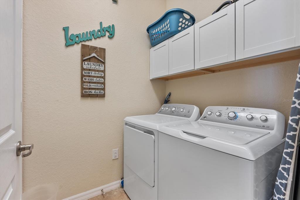 20080 Ragazza Circle, Unit 202 Venice, FL 34293 - Photo 29 of 51 a utility room with dryer and washer