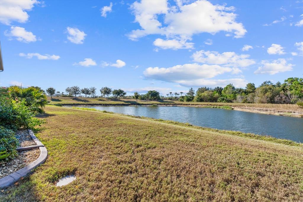 20080 Ragazza Circle, Unit 202 Venice, FL 34293 - Photo 38 of 51 a view of a lake with houses in the back