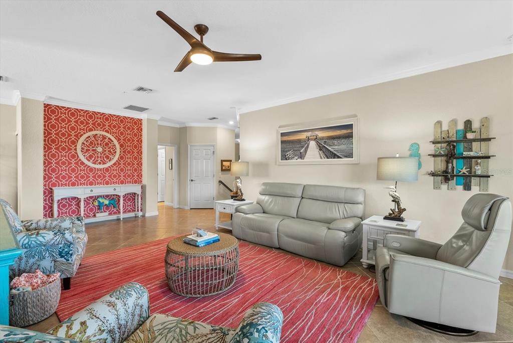 20080 Ragazza Circle, Unit 202 Venice, FL 34293 - Photo 8 of 51 a living room with furniture and a rug