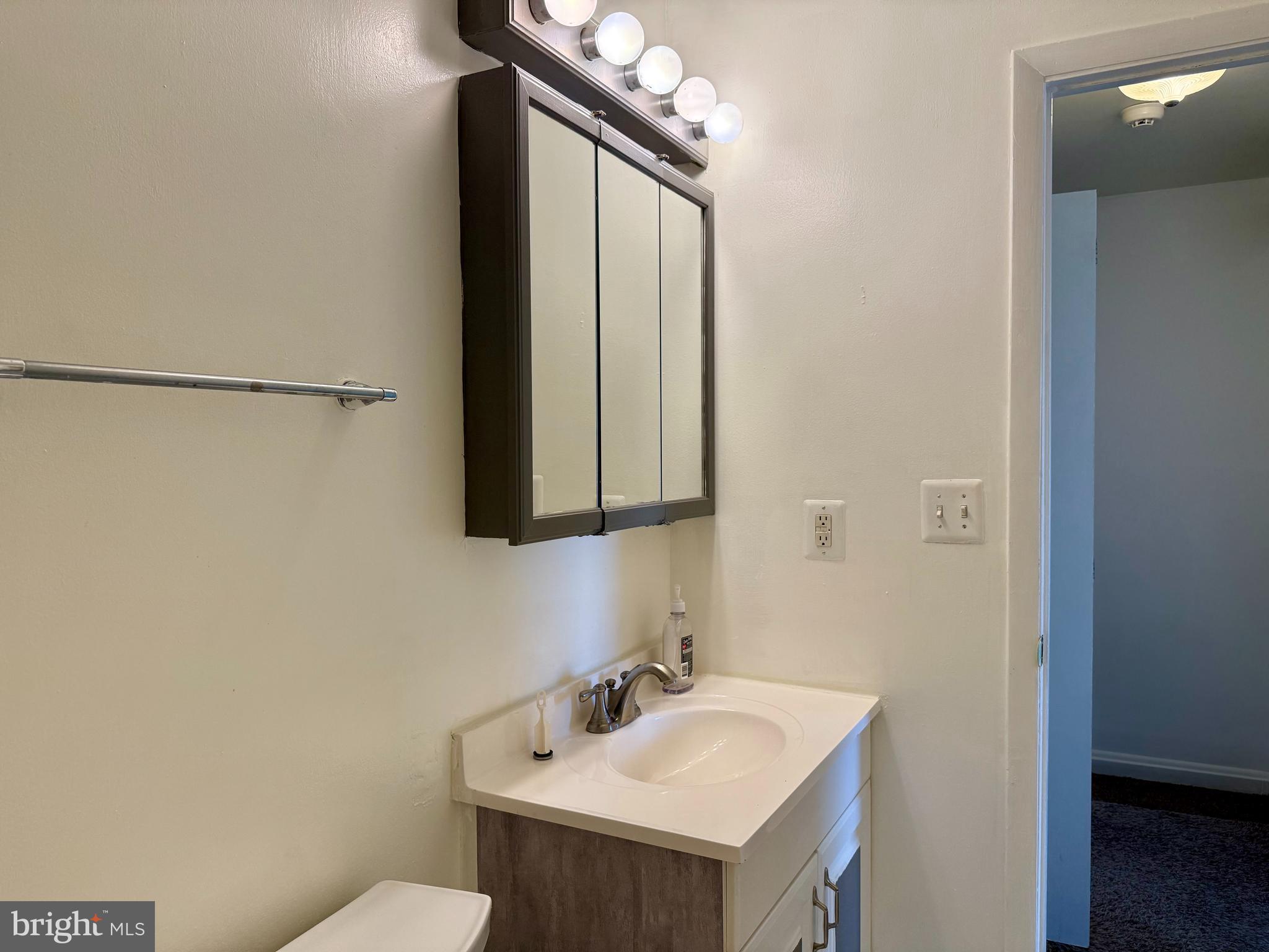 9613 Conmar Road Baltimore, MD 21220 - Photo 17 of 28 a bathroom with a sink and a mirror