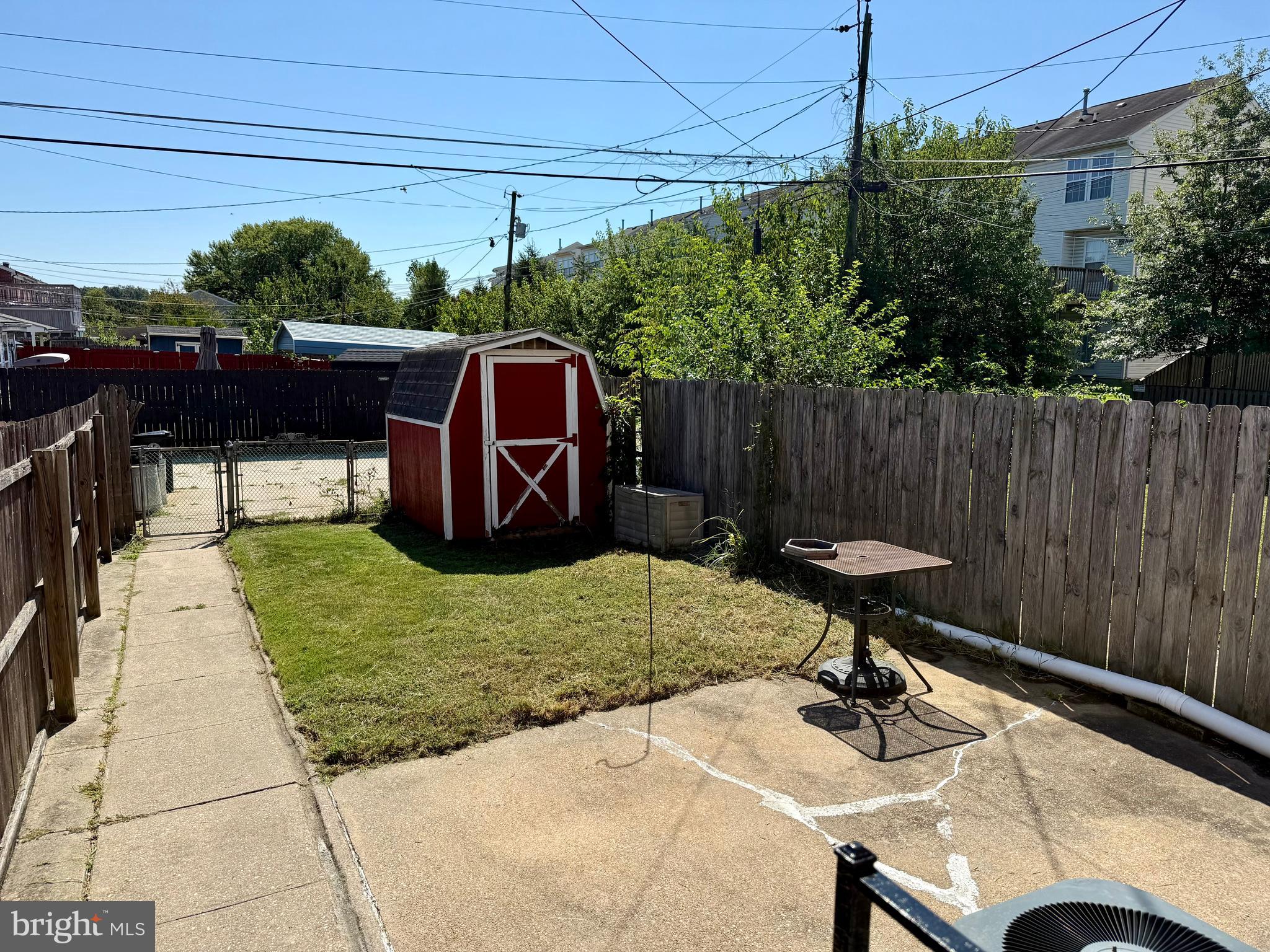 9613 Conmar Road Baltimore, MD 21220 - Photo 28 of 28 a backyard of a house with table and chairs
