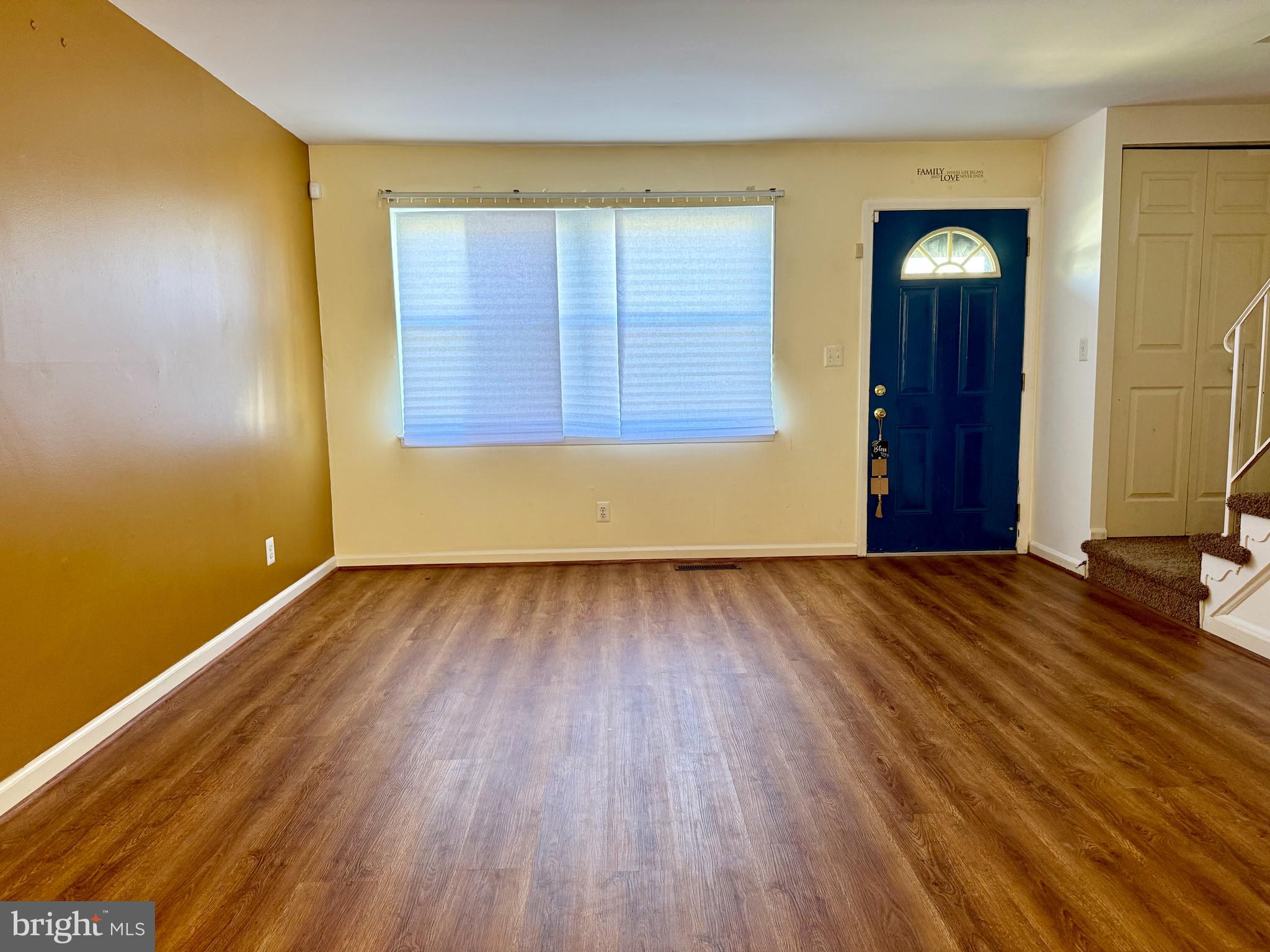 9613 Conmar Road Baltimore, MD 21220 - Photo 4 of 28 a view of a room with wooden floor and stairs