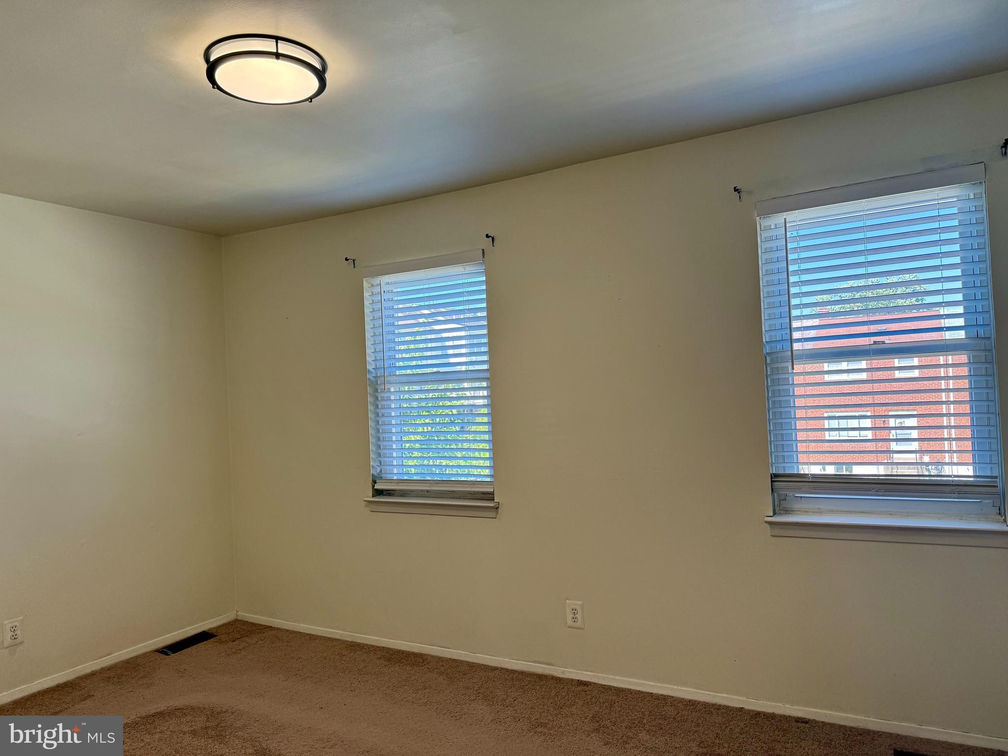 9613 Conmar Road Baltimore, MD 21220 - Photo 9 of 28 an empty room with a window