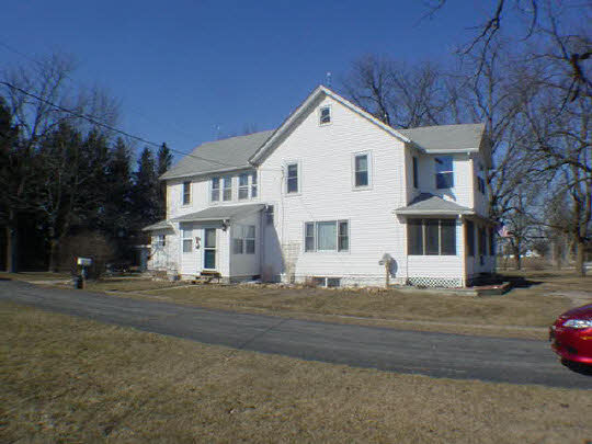 7930 North Eastline Road Maple Park, IL 60151 - Photo 1 of 6 a view of a white house with a street