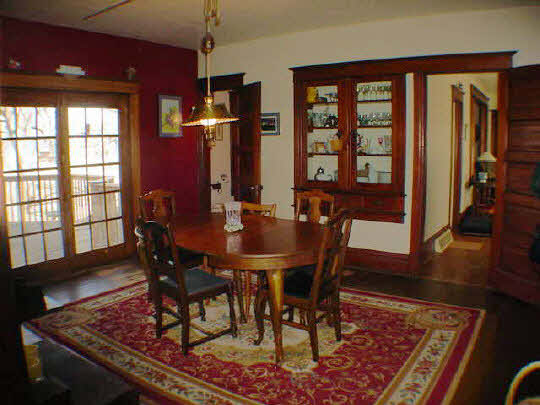 7930 North Eastline Road Maple Park, IL 60151 - Photo 5 of 6 a view of a dining room with furniture window and wooden floor